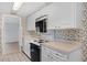 Practical kitchen featuring ample counter space and white cabinetry at 5630 Saint Louis Ave, Sarasota, FL 34233