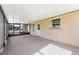 Covered, screened-in porch featuring neutral walls at 5630 Saint Louis Ave, Sarasota, FL 34233