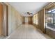 Sunroom featuring tile floors and wood paneling at 5630 Saint Louis Ave, Sarasota, FL 34233