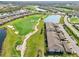 Aerial view of community with golf course and lake at 5721 Palmer Cir # 205, Lakewood Ranch, FL 34211