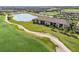 Aerial view of condo building near golf course and lake at 5721 Palmer Cir # 205, Lakewood Ranch, FL 34211