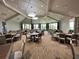 Large banquet hall with many tables and chairs at 5721 Palmer Cir # 205, Lakewood Ranch, FL 34211