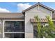 Condo building with Spanish tile roof and screened balcony at 5721 Palmer Cir # 205, Lakewood Ranch, FL 34211