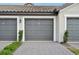 Attached two-car garage with paver driveway at 5721 Palmer Cir # 205, Lakewood Ranch, FL 34211