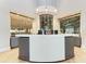 Modern reception desk with a wine display and fish tank at 5721 Palmer Cir # 205, Lakewood Ranch, FL 34211