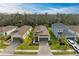 Aerial view of a new home community, showcasing several houses and landscaping at 5866 Bungalow Grove Ct, Palmetto, FL 34221