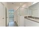 Bathroom with walk-in shower and gray countertop vanity at 5866 Bungalow Grove Ct, Palmetto, FL 34221