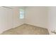 Bright bedroom with neutral carpeting and closet at 5866 Bungalow Grove Ct, Palmetto, FL 34221