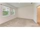 Bright bedroom with neutral carpeting and window at 5866 Bungalow Grove Ct, Palmetto, FL 34221