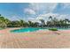 Relaxing community pool with plenty of lounge chairs at 5866 Bungalow Grove Ct, Palmetto, FL 34221