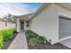 Front entrance of a new home with walkway and landscaping at 5866 Bungalow Grove Ct, Palmetto, FL 34221