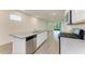 Modern kitchen with stainless steel appliances and island at 5866 Bungalow Grove Ct, Palmetto, FL 34221