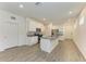 Open concept kitchen with white cabinets and gray countertops at 5866 Bungalow Grove Ct, Palmetto, FL 34221