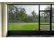 Screened porch with view of the backyard at 5866 Bungalow Grove Ct, Palmetto, FL 34221