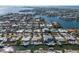 Overhead shot capturing the layout of waterfront homes on canals, showcasing the neighborhood's unique coastal living at 627 Dundee Ln, Holmes Beach, FL 34217