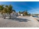 Inviting backyard area with decorative stone, a boat dock, and direct canal access to enjoy waterfront activities at 627 Dundee Ln, Holmes Beach, FL 34217