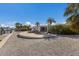 Well-kept backyard leading to private boat dock on waterfront with lush landscaping, perfect for outdoor entertaining at 627 Dundee Ln, Holmes Beach, FL 34217