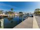 Private dock featuring boat lifts and stunning waterfront views at 627 Dundee Ln, Holmes Beach, FL 34217