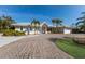 Charming single-story home with a well-manicured front yard and circular driveway at 627 Dundee Ln, Holmes Beach, FL 34217