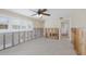 Spacious living room with ceiling fan, and ample space, ready for renovation at 627 Dundee Ln, Holmes Beach, FL 34217