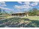 Backyard with screened-in patio of the rural home at 6521 121 St E Ave, Parrish, FL 34219