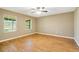 Spacious bedroom featuring tile floors and natural light from the windows at 6521 121 St E Ave, Parrish, FL 34219