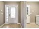 Inviting entryway featuring a decorative glass door and sidelight panels with tile flooring at 6521 121 St E Ave, Parrish, FL 34219