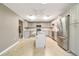 Spacious kitchen featuring an island, stainless steel appliances, and light gray cabinets at 6521 121 St E Ave, Parrish, FL 34219