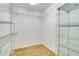 Spacious walk-in closet featuring wire shelving and ceramic tile floors, offering ample storage at 6521 121 St E Ave, Parrish, FL 34219