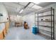 Well-lit workshop with workbench and shelving, providing ample space for crafting and storage at 6521 121 St E Ave, Parrish, FL 34219