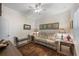 Cozy living room with neutral colors, a ceiling fan, and a comfortable sofa at 6912 Playa Bella Dr, Bradenton, FL 34209