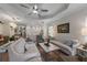 Open-concept living room flows into the kitchen, featuring neutral decor and comfortable seating arrangements at 6912 Playa Bella Dr, Bradenton, FL 34209