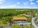 Aerial view of building, parking, and surrounding area at 7 Quails Run Blvd # 9, Englewood, FL 34223