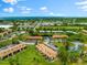 Aerial view showing building and surrounding area at 7 Quails Run Blvd # 9, Englewood, FL 34223