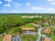 Aerial view highlighting building location and parking at 7 Quails Run Blvd # 9, Englewood, FL 34223