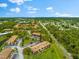 Aerial perspective of building, parking, and landscape at 7 Quails Run Blvd # 9, Englewood, FL 34223