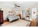 Bedroom with a queen bed and ceiling fan at 7 Quails Run Blvd # 9, Englewood, FL 34223