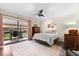 Bedroom with sliding door to patio access at 7 Quails Run Blvd # 9, Englewood, FL 34223