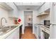 View of kitchen and dining area at 7 Quails Run Blvd # 9, Englewood, FL 34223