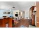 Living room with tile floors, comfy seating, and colorful rug at 7 Quails Run Blvd # 9, Englewood, FL 34223