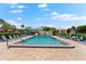 Inviting community pool with plenty of lounge chairs at 7 Quails Run Blvd # 9, Englewood, FL 34223