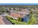 Aerial view of a home with a private screened-in pool and beautifully landscaped backyard at 7103 Westhill Ct, Lakewood Ranch, FL 34202