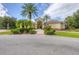 Elegant entrance to the community center, enhanced by landscaping and inviting pathway at 7103 Westhill Ct, Lakewood Ranch, FL 34202