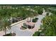 Aerial view of the gated community entrance with manicured landscaping for an impressive arrival at 7103 Westhill Ct, Lakewood Ranch, FL 34202