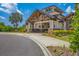 Stunning community center featuring wood beam portico, stone accents, and lush landscaping at 7103 Westhill Ct, Lakewood Ranch, FL 34202