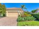 Charming single-story home featuring a two-car garage and beautiful landscaping at 7103 Westhill Ct, Lakewood Ranch, FL 34202