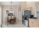 Cozy breakfast nook featuring a round table and modern art at 7327 Kensington Ct, University Park, FL 34201