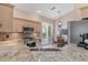 Stylish kitchen featuring granite countertops, stainless steel appliances, and custom cabinets at 7327 Kensington Ct, University Park, FL 34201