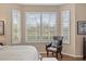 Tranquil main bedroom seating area with bright window views and natural light at 7327 Kensington Ct, University Park, FL 34201