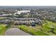 Aerial view of community near golf course and pond at 7812 Birdie Bend Way, Sarasota, FL 34241